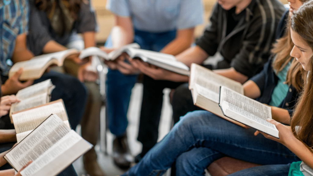 people sitting in circle holding a Bible. Church Equip Curriculum